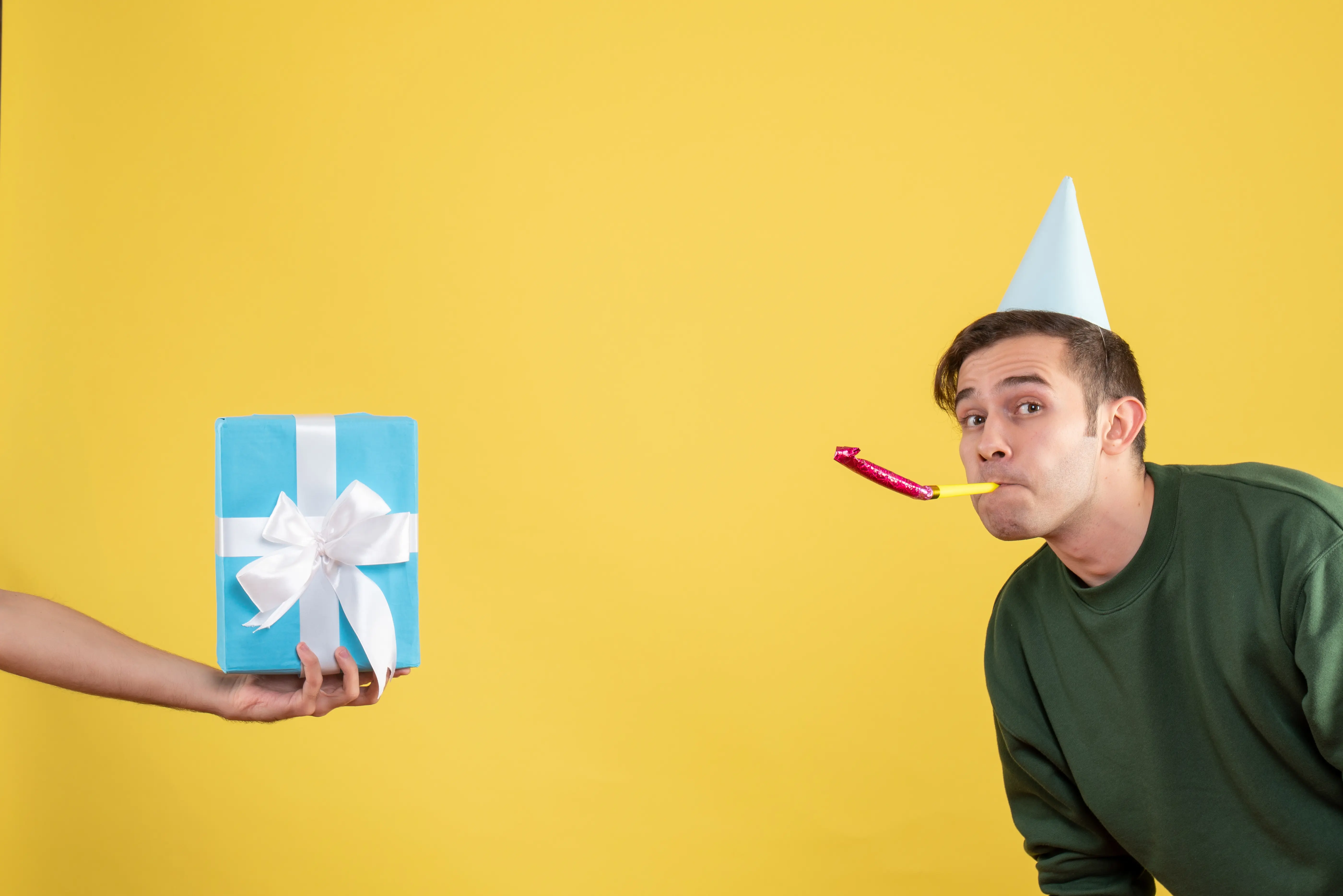 surprised-young-man-using-april fools day-gift