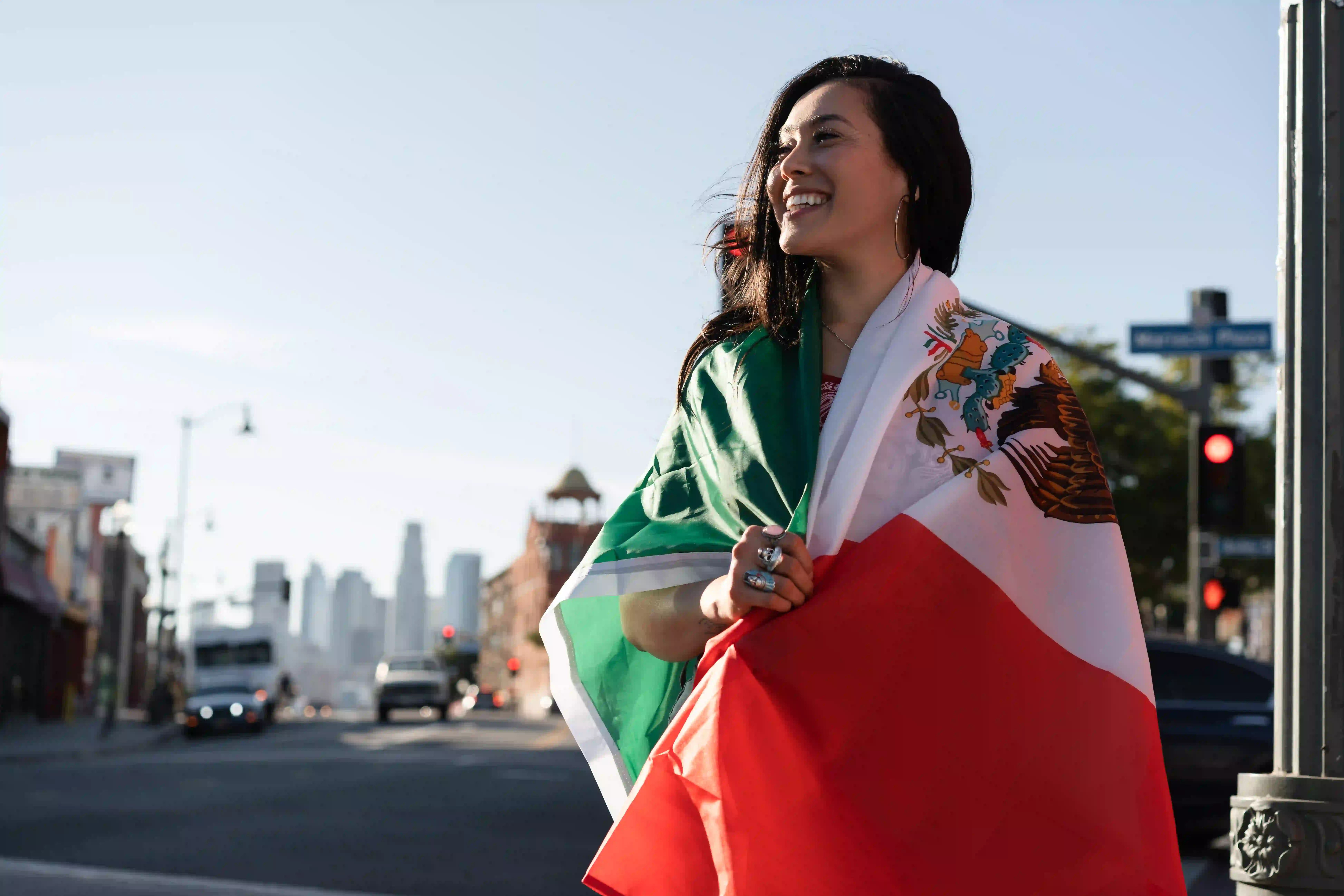 1 woman-holding-mexican-flag-street