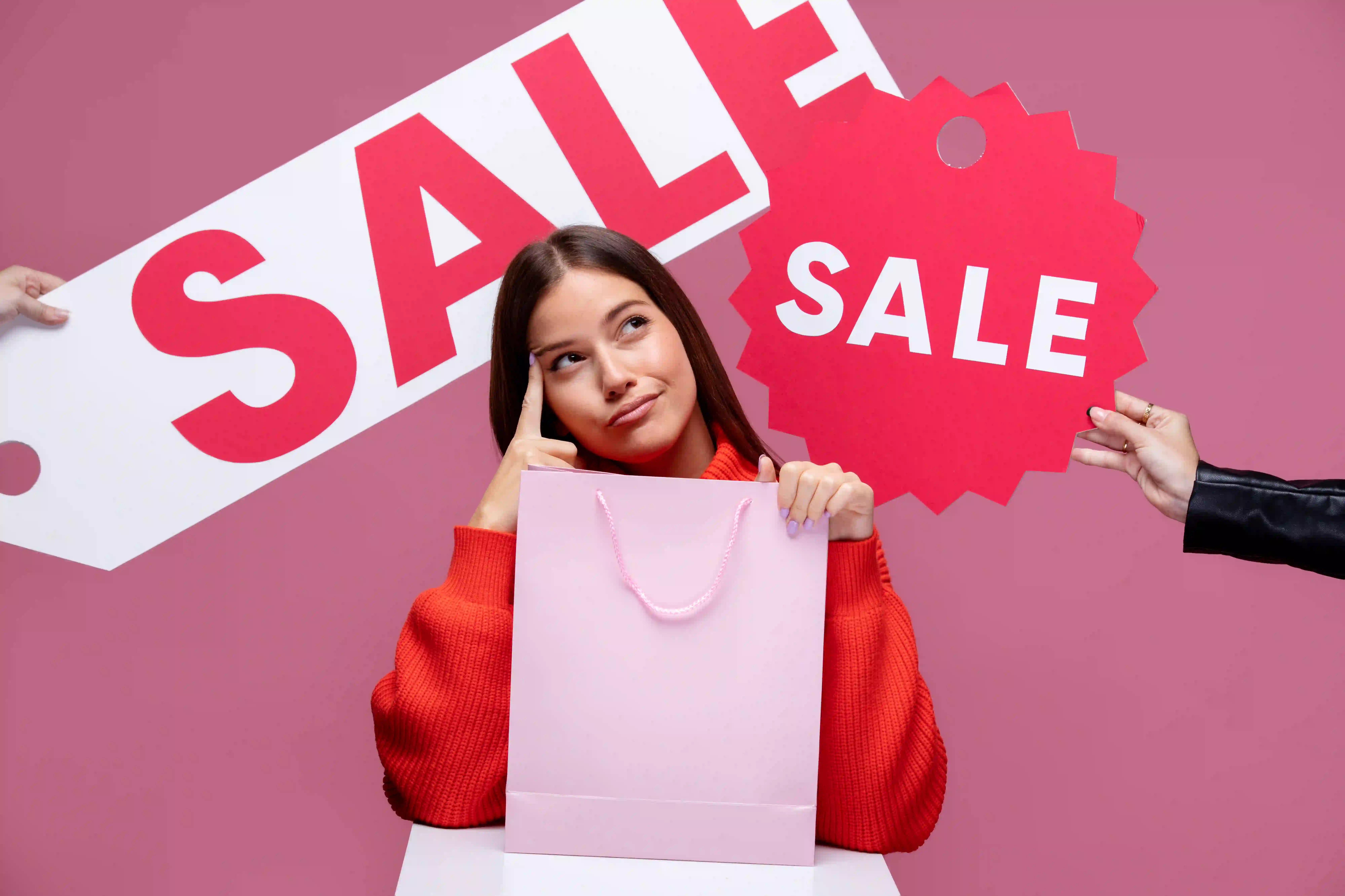 close-up-woman-holding-shopping-bags